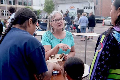 Sheryl talking with Native family